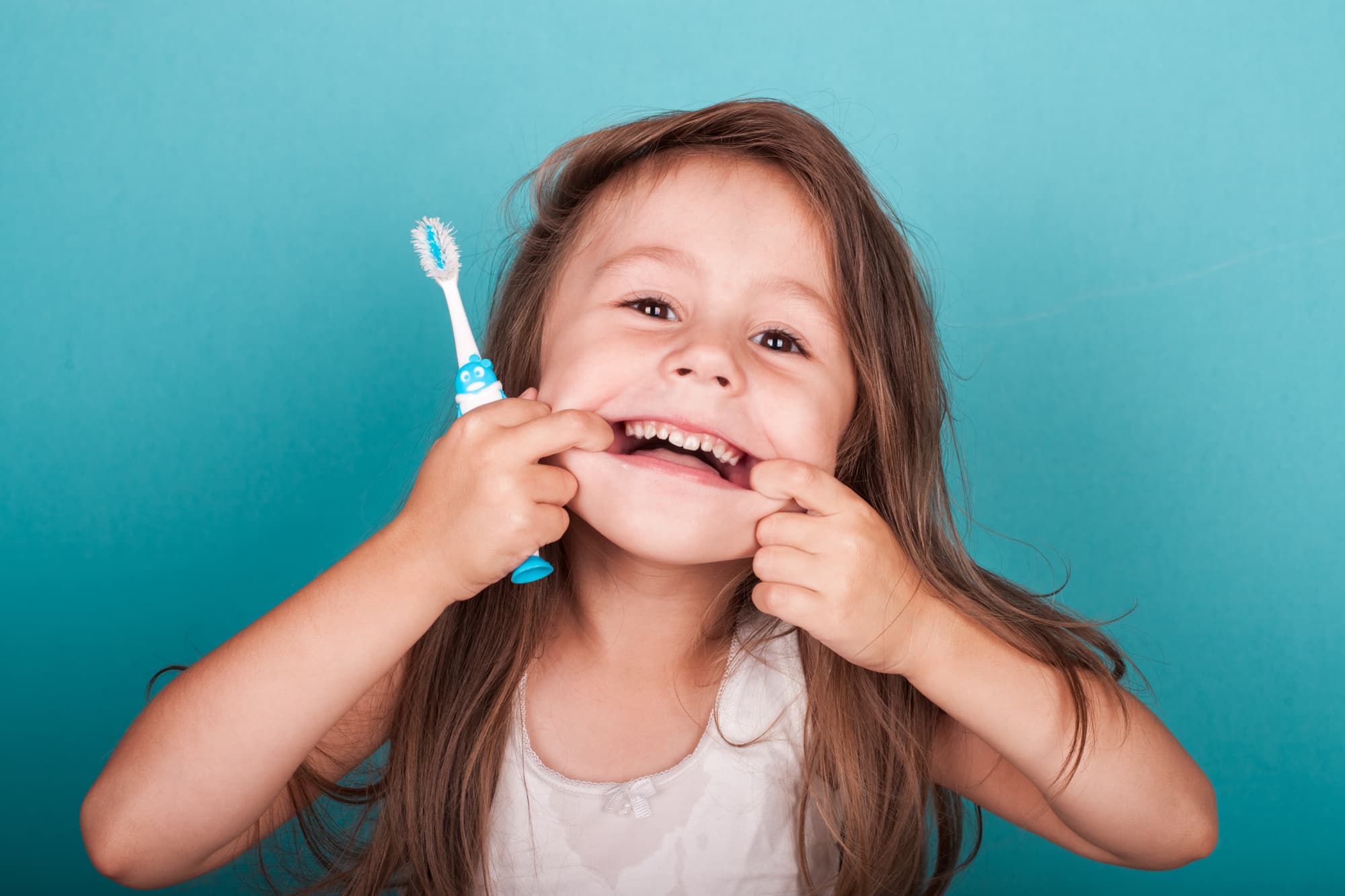 Dr. Goyal providing kid-friendly dental care at Ethos Family Dental